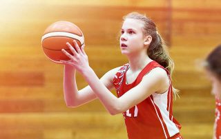Girl Concentrating on a Basketball Shot
